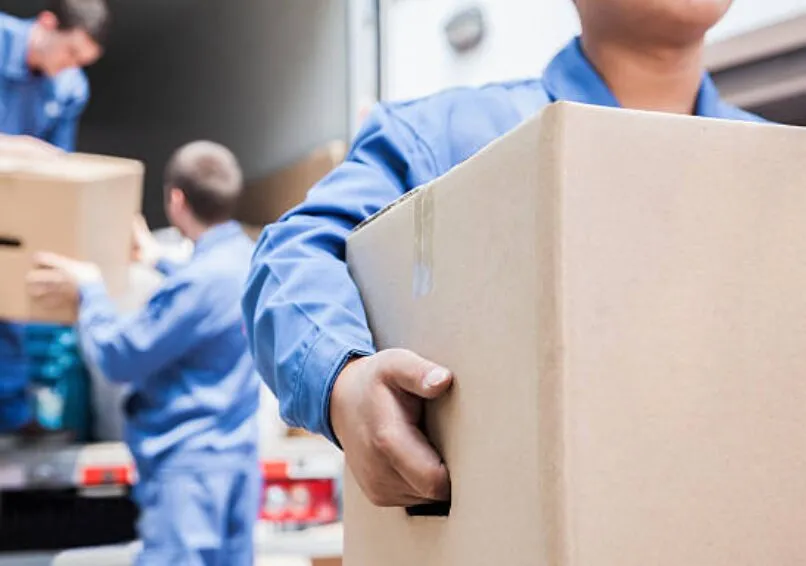 Southwest Packout team member labeling inventoried boxes